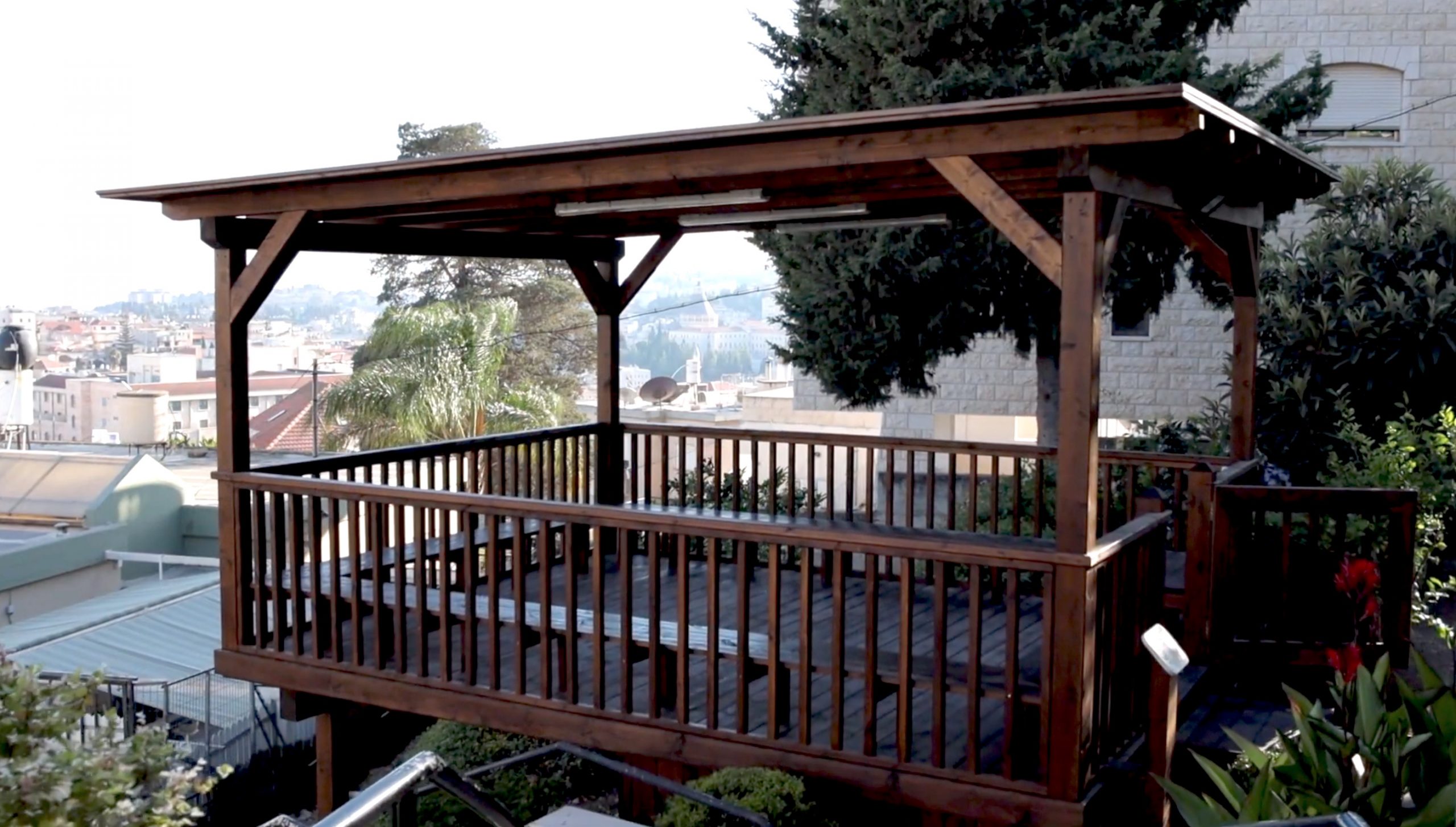 wooden canopy in the prayer garden of the baptist house in nazareth