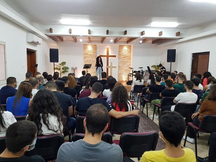 Luna welcoming the young people at the regional youth meeting at the baptist church in rameh