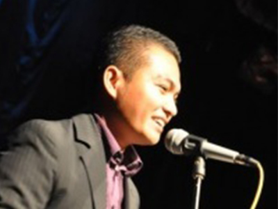 pastor of the philippino baptist church preaching