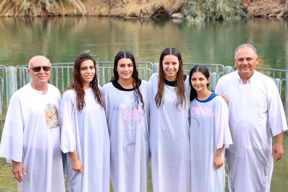 Pastor Khalid Dalleh, and church elder, Ghassan Odeh, with the four girls who got baptized