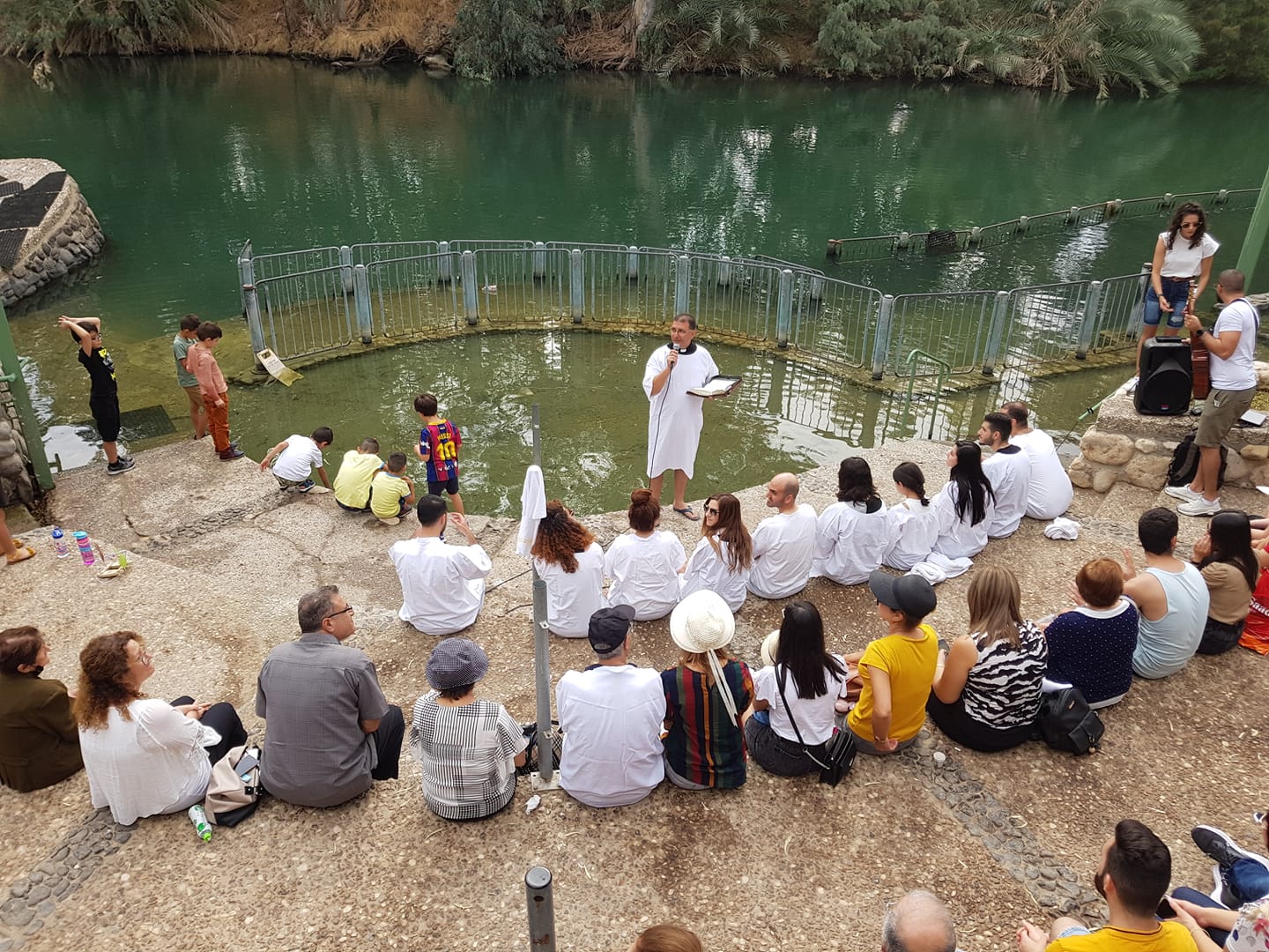 the shafaamr baptist church gathered at the baptismal site