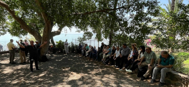 pastors and their spouses intently learning about the different aspects of the location where new testament stories took place