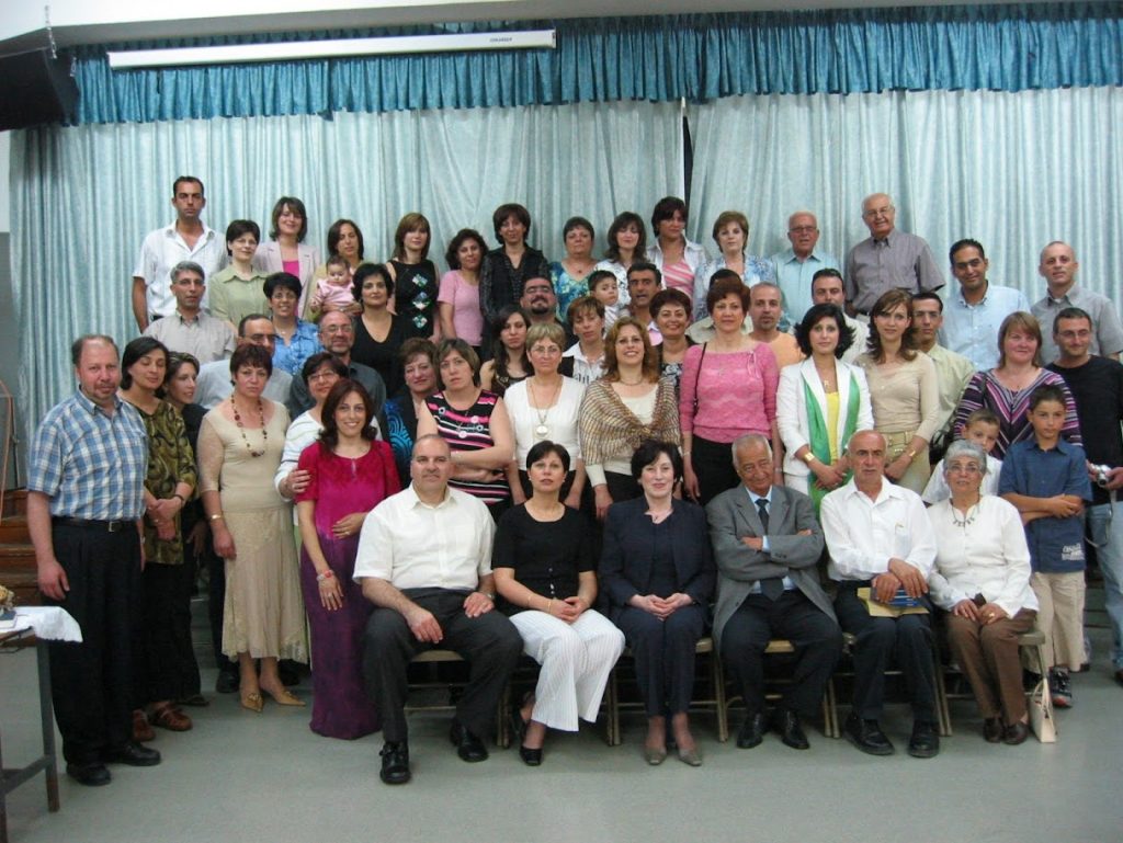 Eliya Qubty with teachers at school