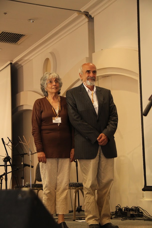 Eliya Qubty being honored by Rev. Azar Ajaj